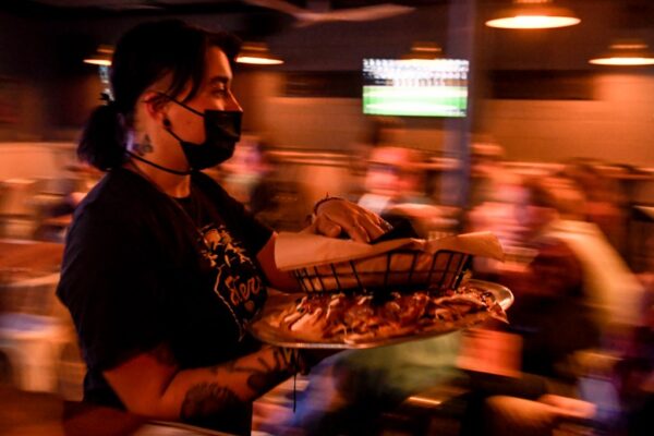 Colorado Governor Signs Amended Restaurant Wage Bill Amid Controversy