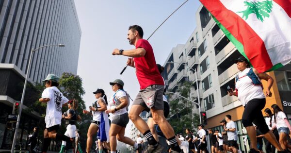 Los Angeles Residents Unite for the Run Against ICE Amid Tensions Over Immigration Raids